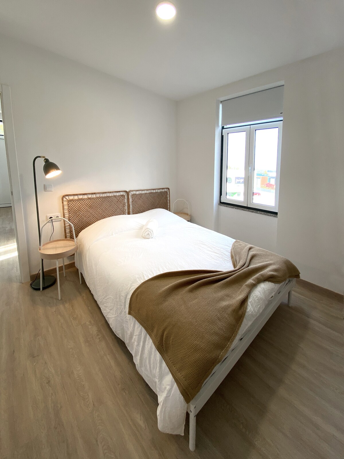 Bedroom with rattan headboard