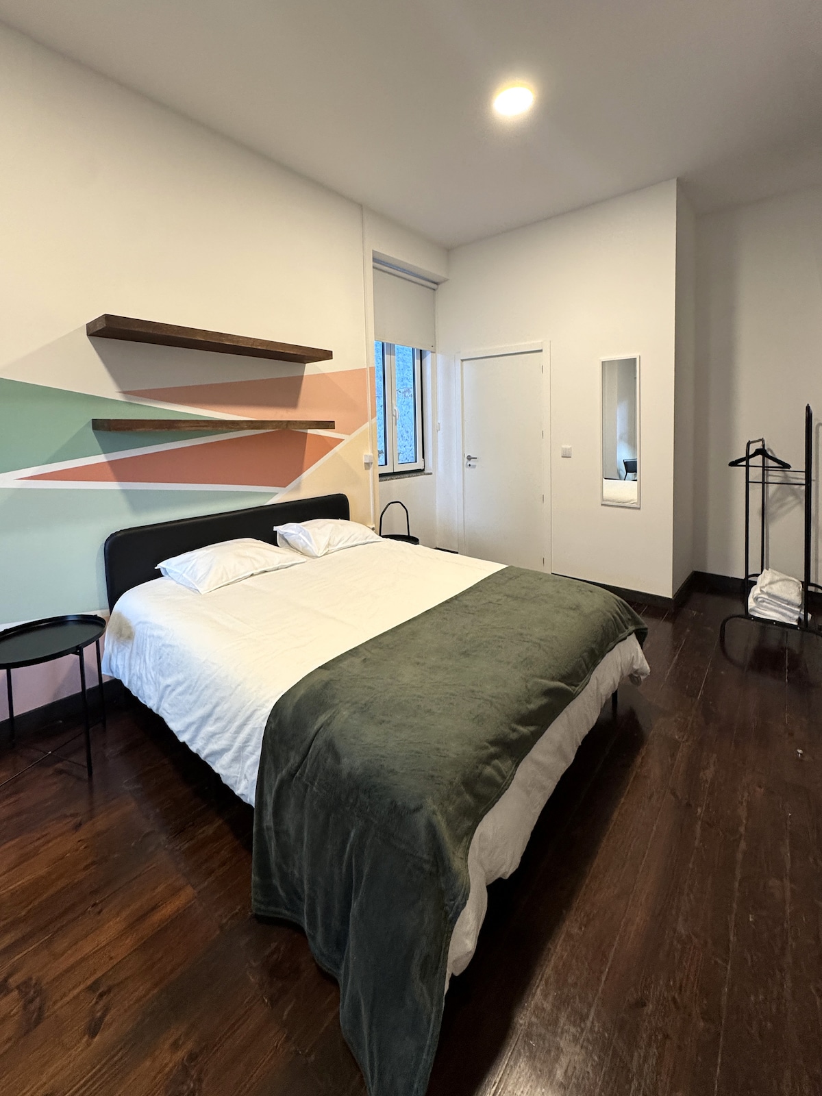 Bedroom with geometric wall mural